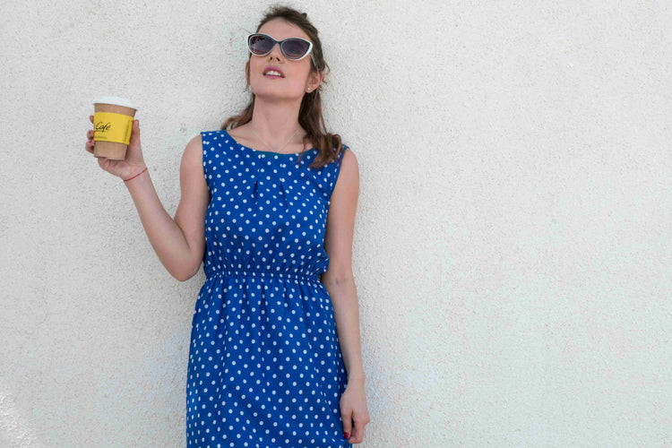 A women in blue polka dot dress